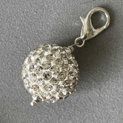 White cernit pearl with rhinestones.